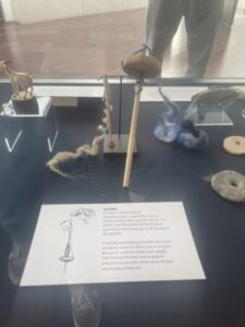 Chalcolithic-era spindle with fiber samples and weights on display at Loyola Marymount University’s student-curated exhibit, “A Glimpse into Ghassul”